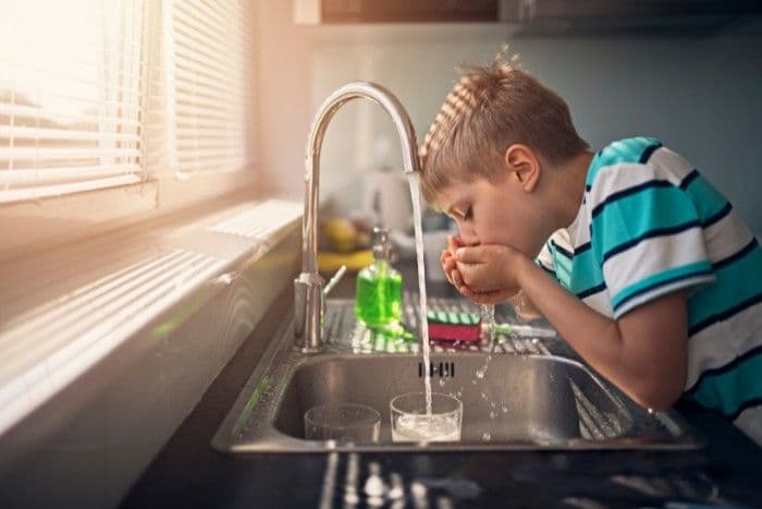Child drinking RO water