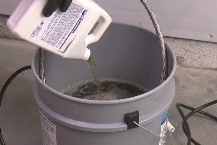 Descaling process to remove mineral buildup from plumbing and water heater