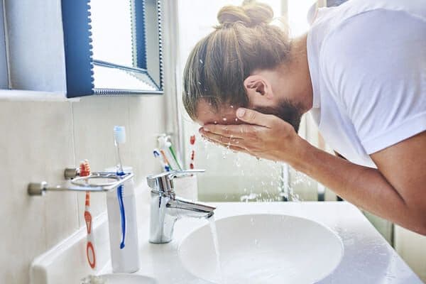Daily face washing showing how minerals in hard water affect skin