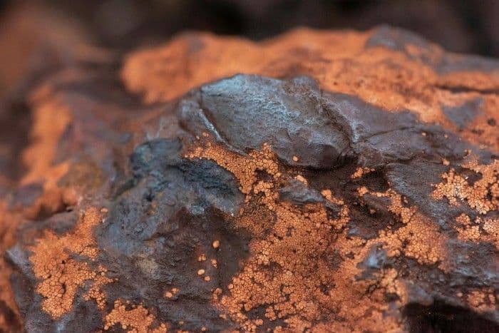 Rust colored iron buildup illustrating why iron treatment in water may be needed
