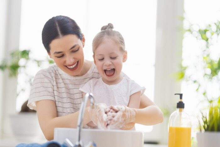Family using conditioned water from a salt-free softening system