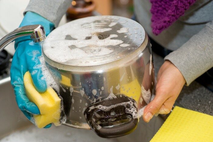 Hard water causing soap to lather poorly while washing dishes, insufficient water softening