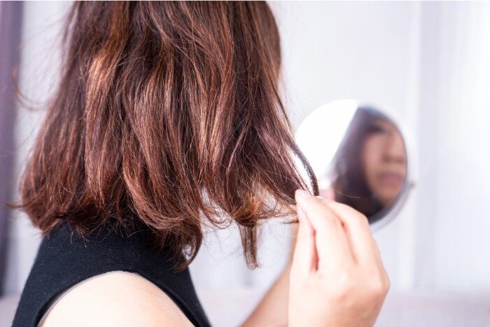 Close-up of hair dryness and breakage linked to hard water