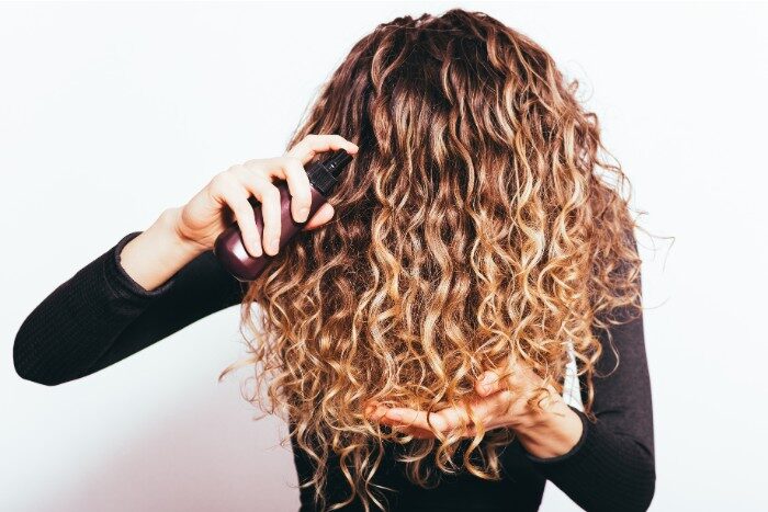 Curly hair maintenance after soft or hard water exposure
