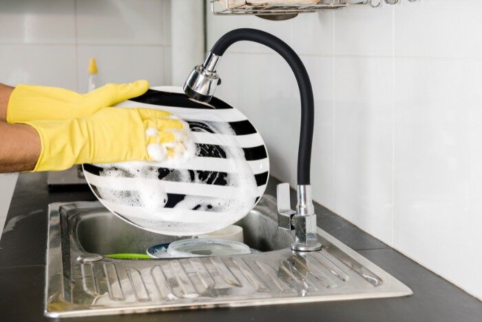 Increased soap lather while washing dishes with softened water from salt-based water system