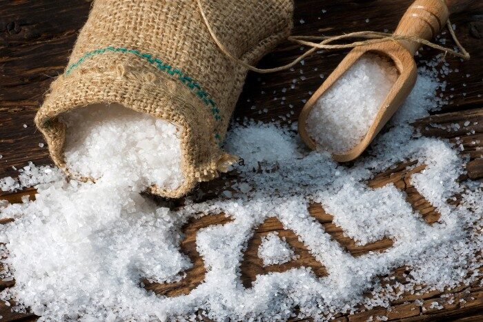 Bag and scoop of salt for water treatment in Arizona homes