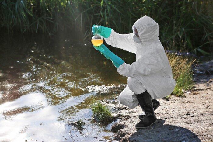 Environmental scientist collecting Arizona water sample to analyze contaminants and diseases residents can get from tap water