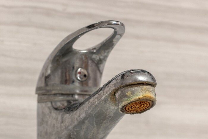 Phoenix faucet showing mineral buildup caused by hard water