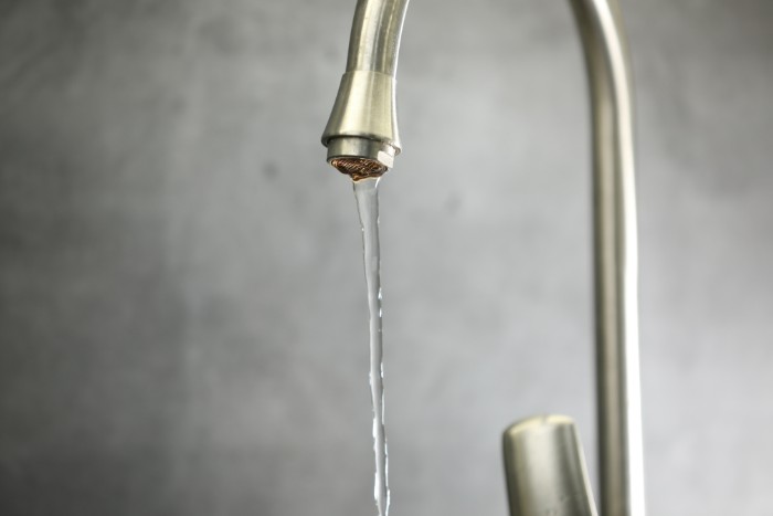 Reduced water flow caused by scale buildup in plumbing signaling need for descaling