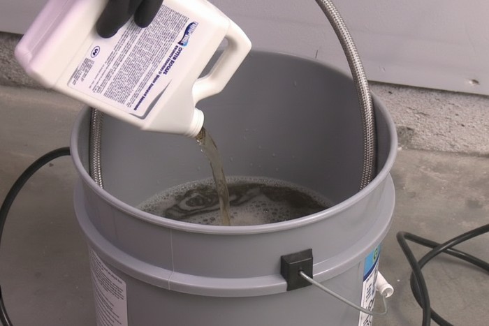 Descaling process to remove mineral buildup from plumbing and water heater