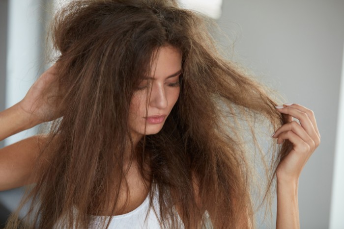 Dull and dry hair, a common nuisance issue associated with hard water use