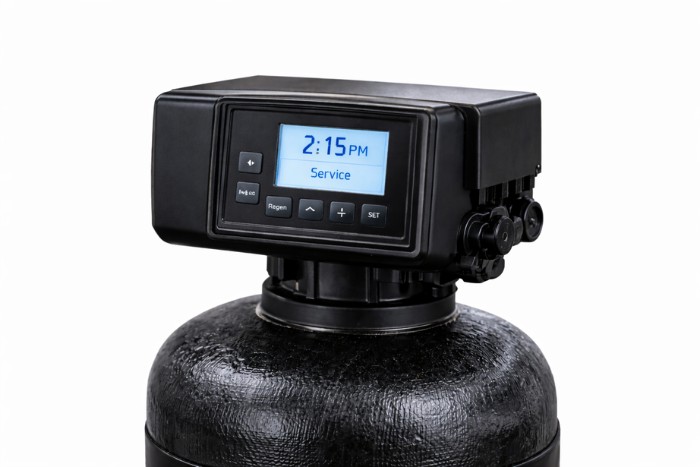 Water softener control head mounted on resin tank for whole home treatment