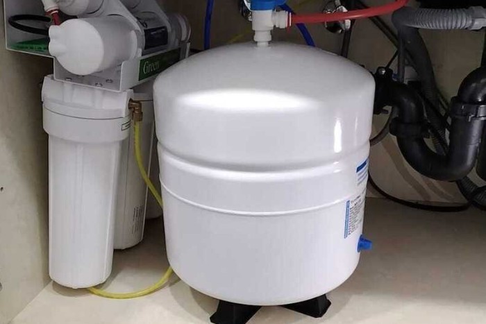 Newly serviced reverse osmosis filters and maintained under sink plumbing system