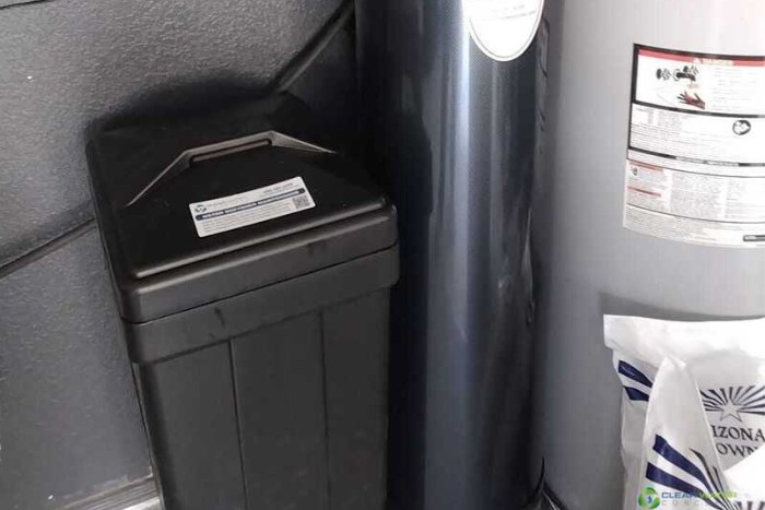 Modern water softener brine tank setup in an Arizona residential garage