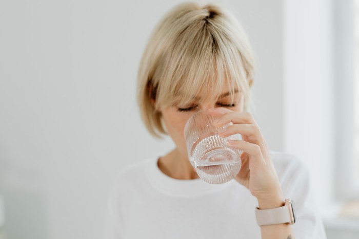 Arizona homeowner enjoying clean filtered drinking water