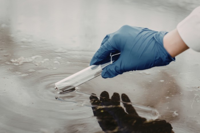 Water quality testing sample being taken from Arizona water source