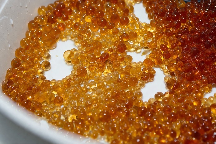 Close up of ion exchange resin beads inside water softener